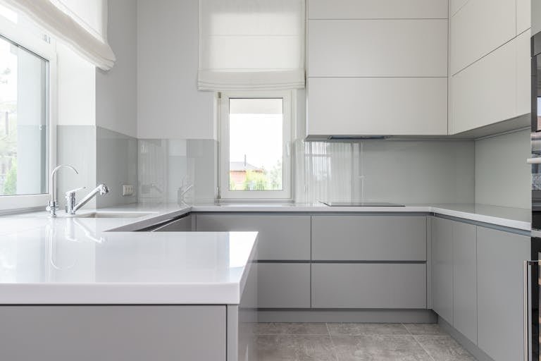 Contemporary kitchen with minimal white interior - decluttering quick wins