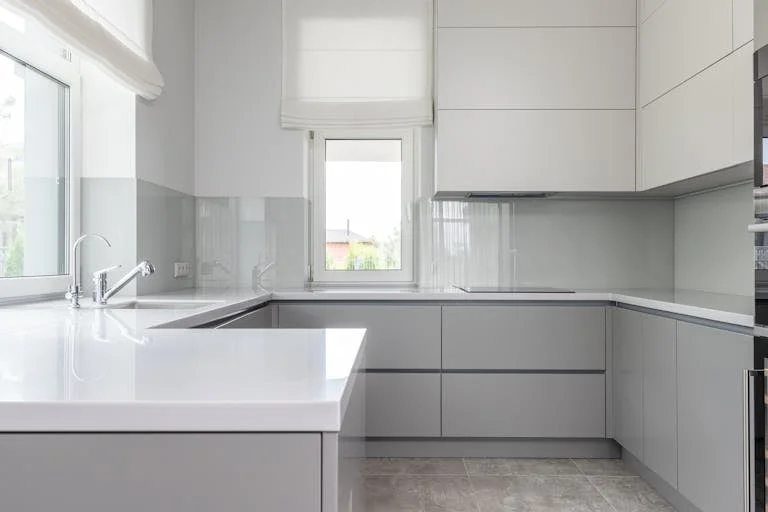 Contemporary kitchen with minimal white interior - decluttering quick wins